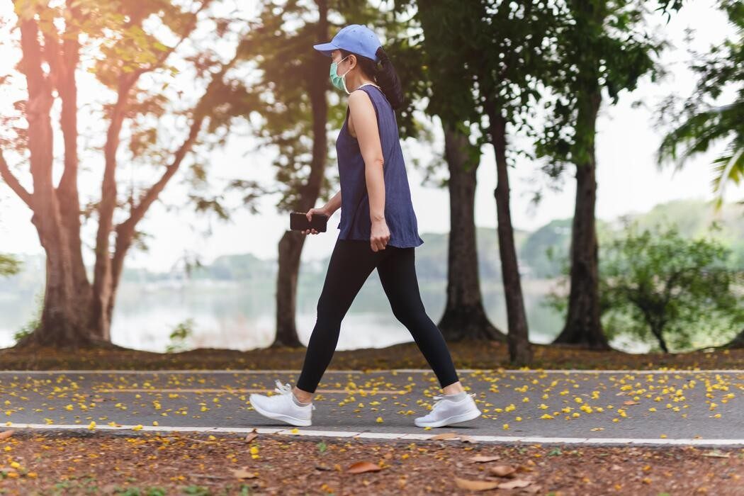 full-length-of-woman-in-medical-mask-exercise-walking-in-the-park-free-photo-1784221457.jpg