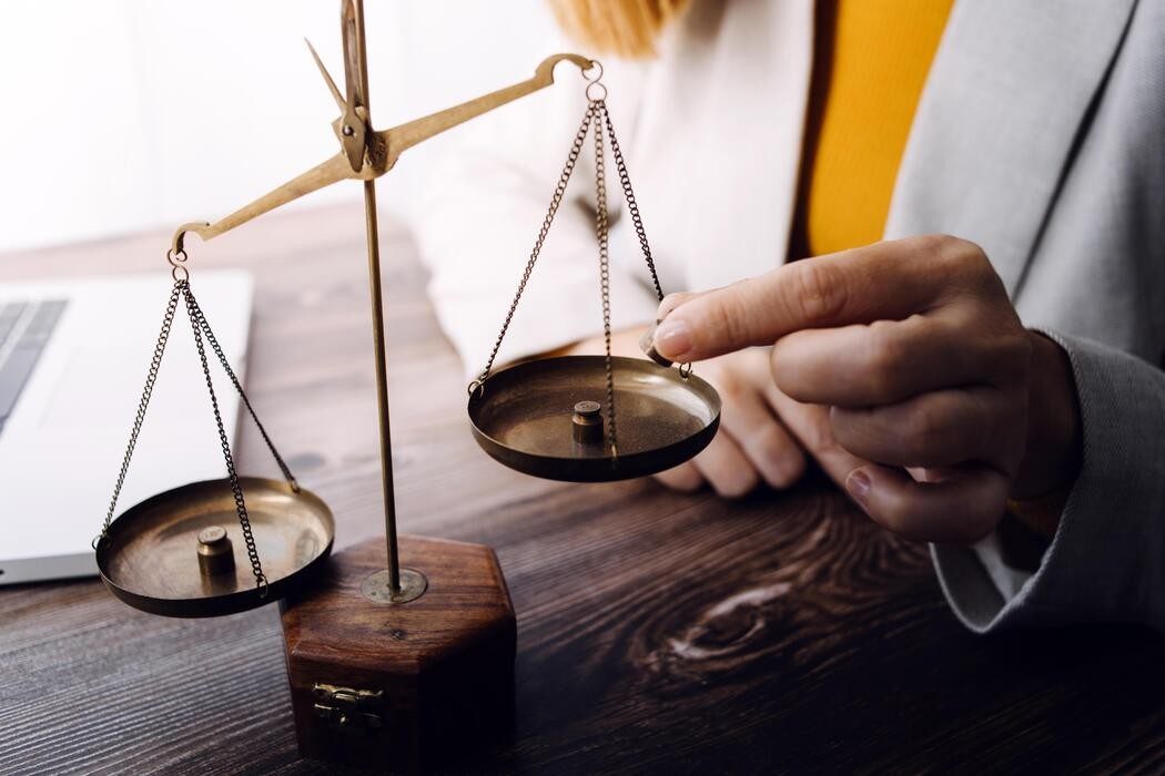 justice-and-law-concept-male-judge-in-a-courtroom-with-the-gavel-working-with-computer-and-docking-keyboard-eyeglasses-on-table-in-morning-light-free-photo-1787080831.jpg