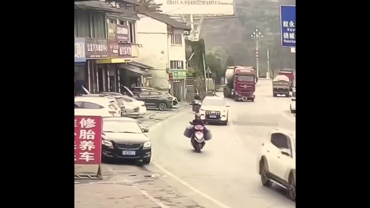 dramatic-escape-truck-drags-motorcycle-and-rider-for-meters-after-collision-buy-sell-or-upload-vide-1709713617.mp4