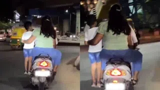 Clip: Cặp đôi đi xe máy, cho con trai "làm xiếc" giữa đường gây phẫn nộ