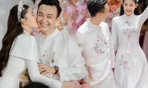 Lê Âu Ngân Anh diện áo dài trắng thêu đóa bạch trà, đồng điệu bên chồng trong đám hỏi