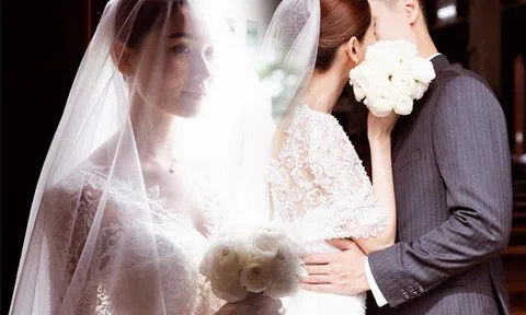 Á hậu Thuỳ Dung diện váy cưới ren Pháp, đẹp tựa nữ thần cùng ông xã tiến vào lễ đường