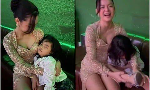 Phía sau hậu trường lộng lẫy, Phạm Quỳnh Anh ôm con gái theo mẹ đi biểu diễn đến tối khuya, nhìn cảnh thấy thương
