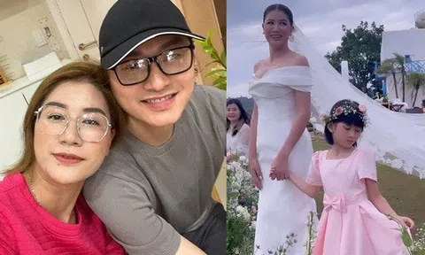 Lấy chồng 2 năm chưa làm đám cưới, Trang Trần nay làm cô dâu lộng lẫy, nắm tay con gái vào lễ đường