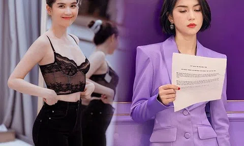 Hóa thân cô biên tập viên, Ngọc Trinh mặc vest nhưng không đính kèm nội y, chật vật kéo chỉnh