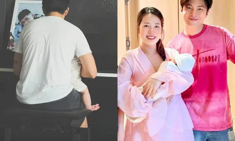 Puka khoe cảnh chồng bế ru con sau nửa năm sinh bé đầu lòng, nhóc tì nay bụ bẫm với đầu đầy tóc