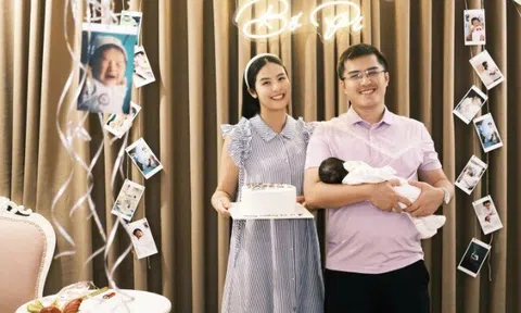 Hoa hậu Ngọc Hân bế con trai tổ chức sinh nhật cho chồng, quý tử nay khôi ngô nằm ngủ ngoan trong lòng bố