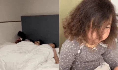 Cặp vợ chồng ngủ say không hay biết gì, hành động con gái làm với em sơ sinh ở góc giường khiến ai nấy nghẹn ngào