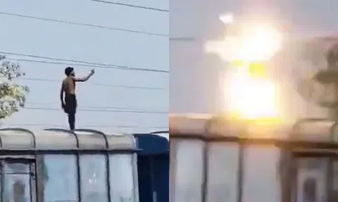 Bất chấp tiếng la hét can ngăn, chàng trai trẻ vẫn làm hành động này trên nóc tàu