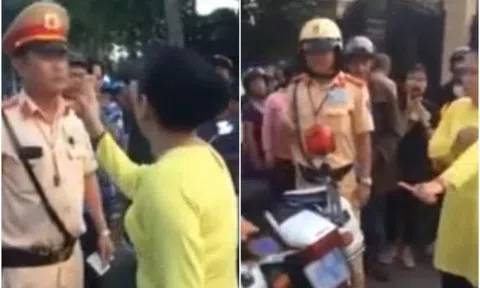 Chồng bị bắt xe, vợ chống tay chửi mắng CSGT